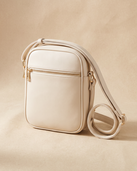 Bolso Nube crossbody en piel vegana crema con cremallera dorada